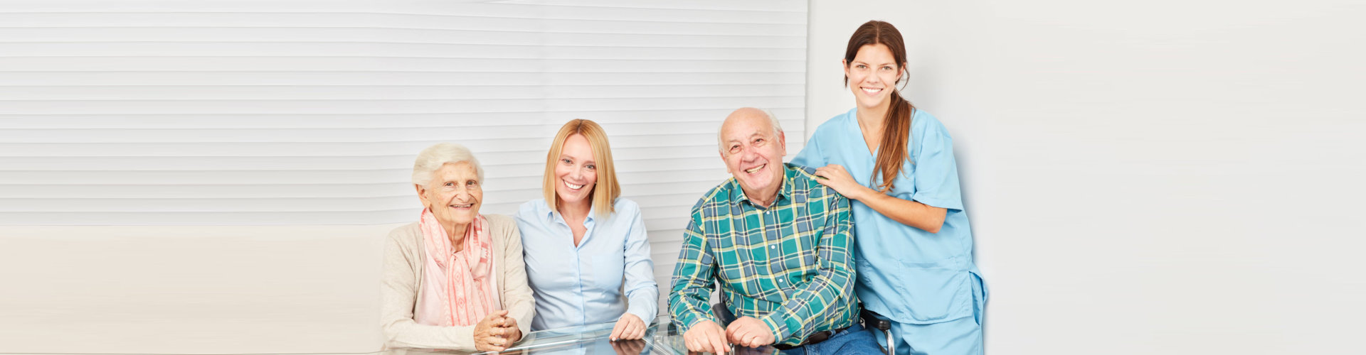 caregiver smiling along with their patients